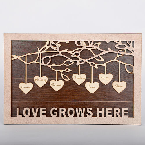 Cadre avec nom " L'amour grandit ici " personnalisé gravé en forme de cœur